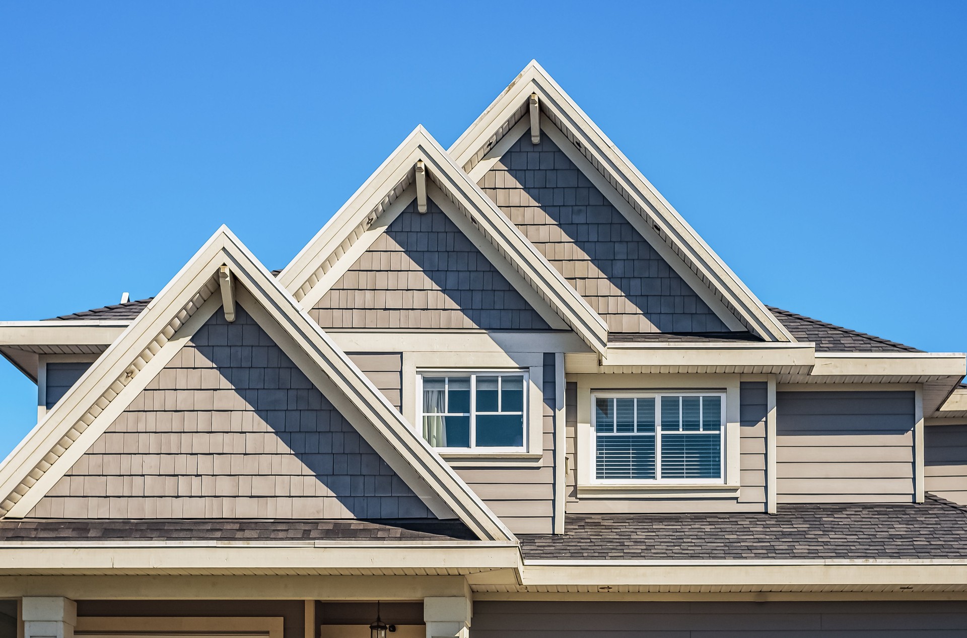 Facade of a house with nice windows. Real Estate Exterior Front House in a residential neighborhood.